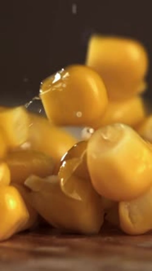 Canned Corn Falls on a Wooden Plank Filmed on a Highspeed Camera at 1000 Fps