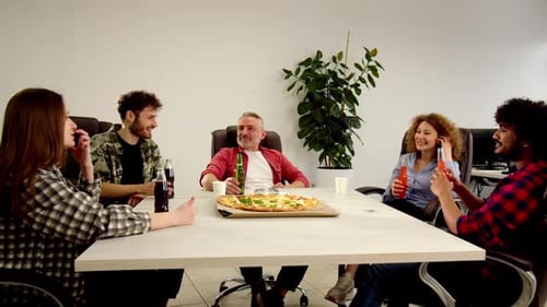Smiling Colleagues Eating Pizza in Office Group of Coworkers Celebrating Something Together