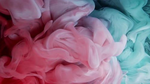 Swirling Red and Teal Ink in Abstract Motion