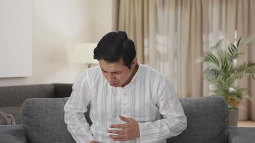 Sick Indian man having a cold and cough
