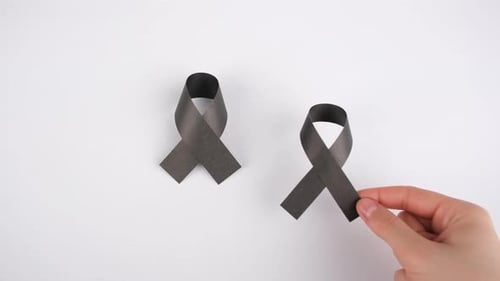 black ribbon symbol