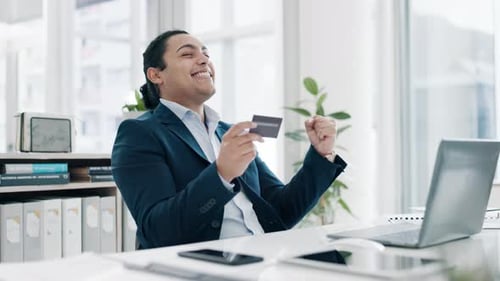 Man, success or credit card at laptop in office for winning, financial freedom and savings deal