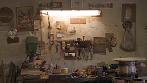 tools on the wall and table in an old workshop