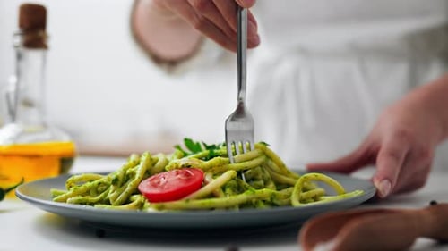 Close Up Of Cooked Pasta, Spaghetti Noodles Green. Cooked Food Green Color Vegetarian Healthy Eating
