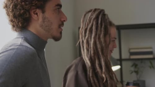 Multiracial Coworkers Having Meeting in Office