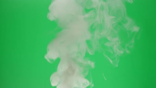 Smoke on Green Chroma Key Background Smoking Steam Clouds of Vapour Closeup Burning Fog