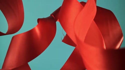 Red Ribbon Abstract Motion on Blue Background