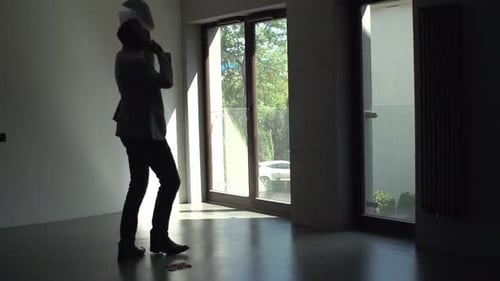 Man Talking on Phone Inside Modern Apartment