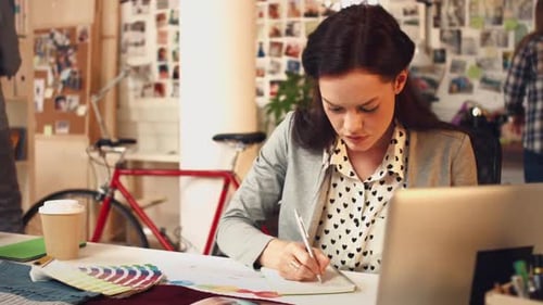 Designer, notebook and professional woman with swatch for project, agency development