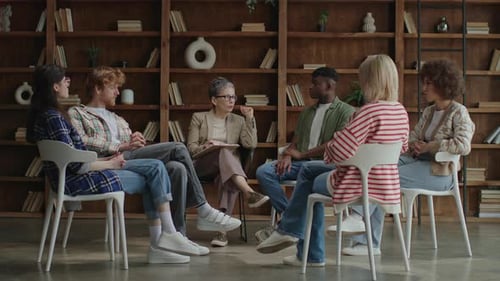 Adults Sitting in a Circle Having a Group Discussion