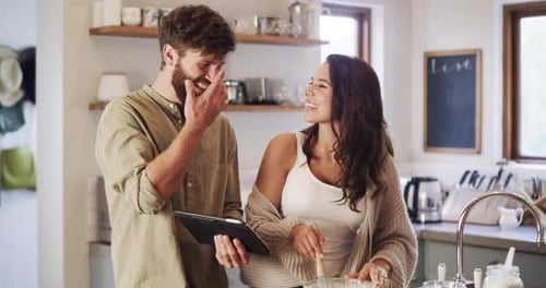 Couple Baking Together in a Bright Kitchen