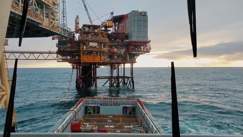 Platform supply vessel PSV near Oil Rig and drilling platform