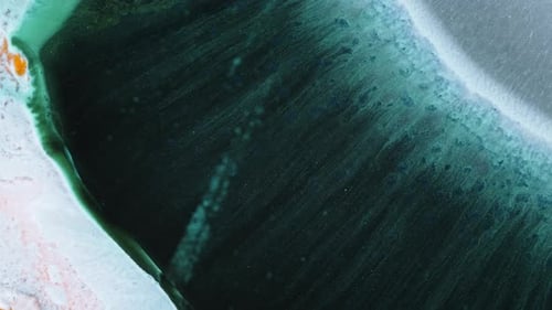 Alcohol ink flows in shot creating elegant abstract organic forms and color blends