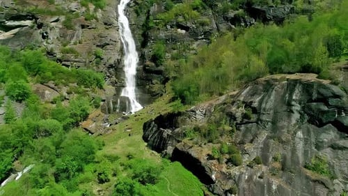 Drone Shot of Picturesque Falls in Landscape of Norway. Waterfall, Green Trees and Rocky Cliffs on S