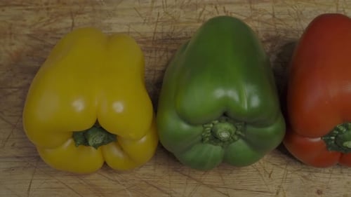 Three sweet peppers. Three colorful bell peppers red yellow and green colors in a row.