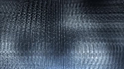 Une onde lumineuse abstraite provenant de particules et de points se déplace sur un fond bleu, visualisation de données volumineuses