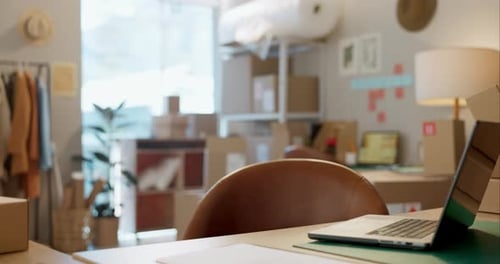 Empty office in startup, desk or laptop for e commerce, small business order or inventory in shop