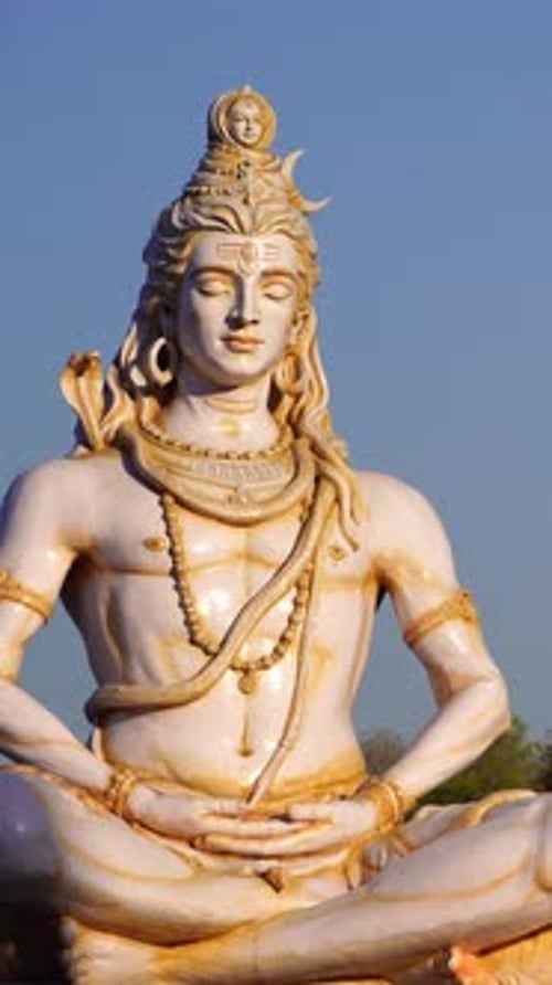 white sculpture of god shiva meditating vertical video
