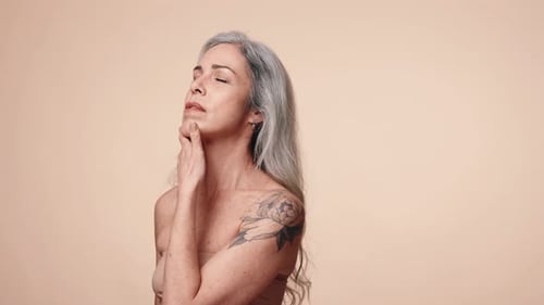 Elegant Senior Woman Embracing Beauty in Studio