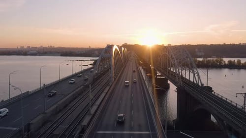 Beautiful Urban Landscape with Cars Moving on Bridge Over the River