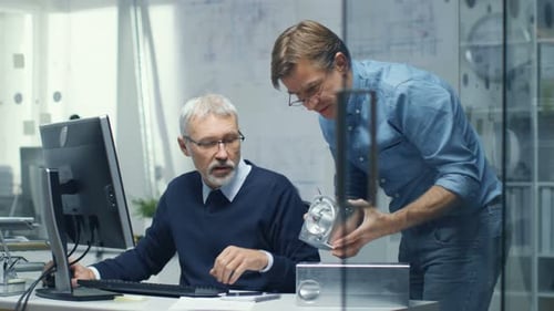 Two Senior Engineers Discuss Important Technical Component. Both are Experienced and Wise. Their Of