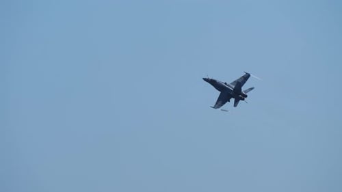 Military Fighter Jet Flying in Blue Sky