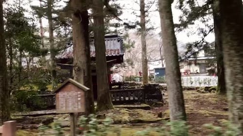 driving past small shrine on the road