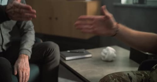 Close Up of Military Man and Professional Therapist Shaking Hands