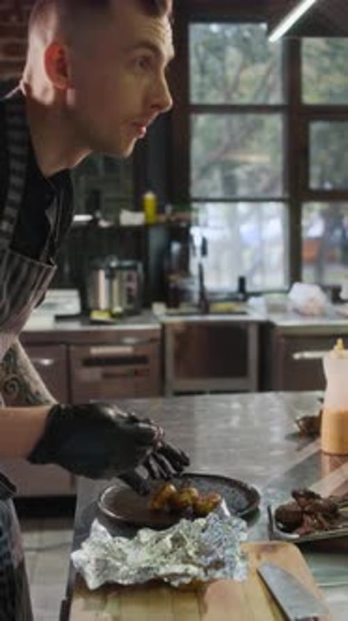 Man Prepares Food in Restaurant Kitchen
