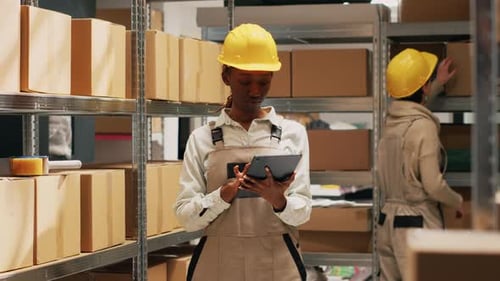 African American Woman Holding Tablet to Do Inventory