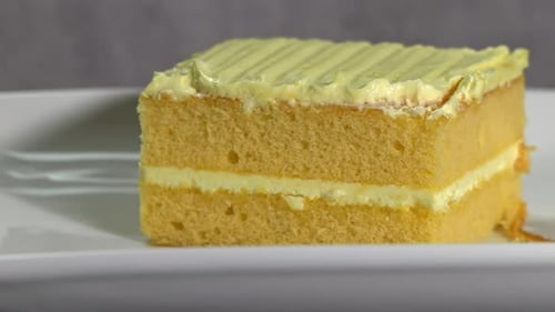 Slow Motion view of a Slice of Cake rotating on a table. Shot in 4K at 60fps.