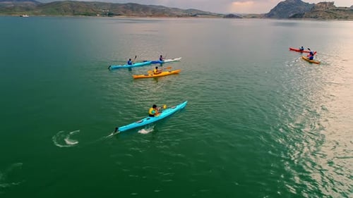 Colorful Kayaks on Clear Green Water