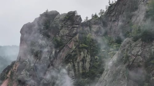 Majestic Misty Mountain Peaks Shrouded in Steam and Fog Embracing the Enchanting Forest