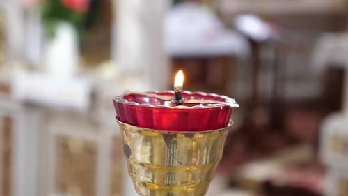 08 1Lamp with a candle in the interior of an Orthodox church