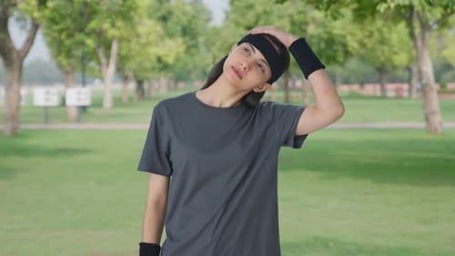 Indian girl doing neck stretching