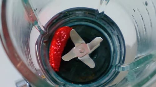 Strawberries Falling into Glass Blender for Smoothie