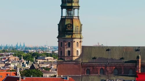 Telephoto Drone Flight Past St Peters Church Tower Riga With Urban City Skyline
