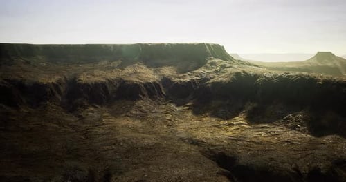 Rocky Landscape with Rugged Terrain and Distant Plateau in Daylight