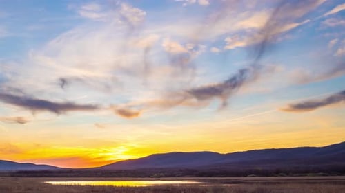View of the Sunset Sky with Clouds Over the Balkan Mountains and the Black Sea Bay Near the Beach