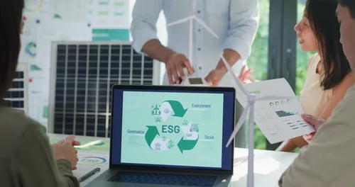 Closeup group diverse Asia businesspeople talk ESG strategies risk management workshop at office.