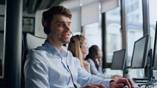 Call Center Operator Talking Headset In Data Office. Friendly Man Representative Typing Keyboard ...