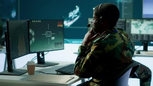 Army Professional in Uniform Works in a Mission Control Center