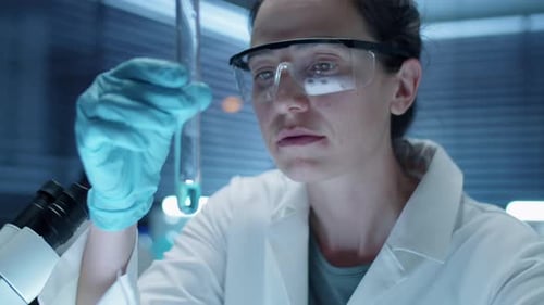Scientist Examining Test Tube in Lab