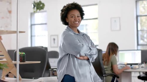 Portrait of happy african american casual businesswoman in office, slow motion