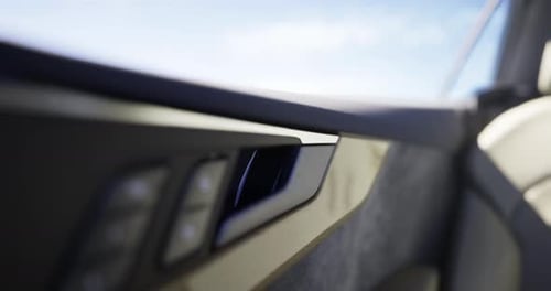 Close View of a Modern Car Interior Featuring Sleek Door Panel Design
