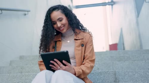 Smile, stairs and woman typing on tablet in city for social media, internet conversation