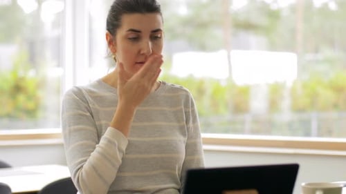 Woman Feeling Sick While Using Laptop