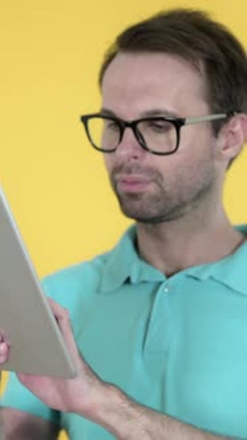 Man Browsing Internet, Using Tablet, Vertical Video