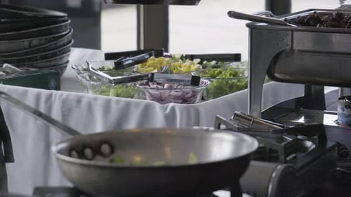 Chef Preparing Food at Indoor Food Service Station