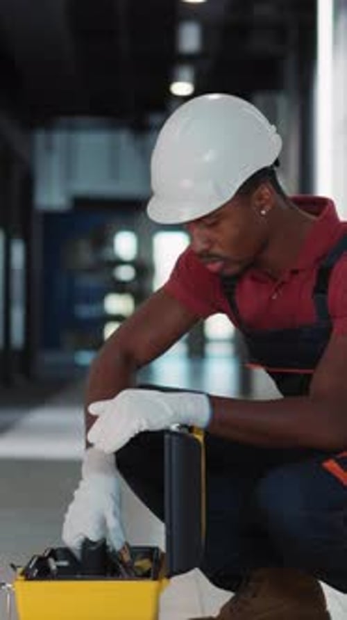 A Dedicated and Focused Construction Worker Wearing Essential Safety Gear on the Job Site